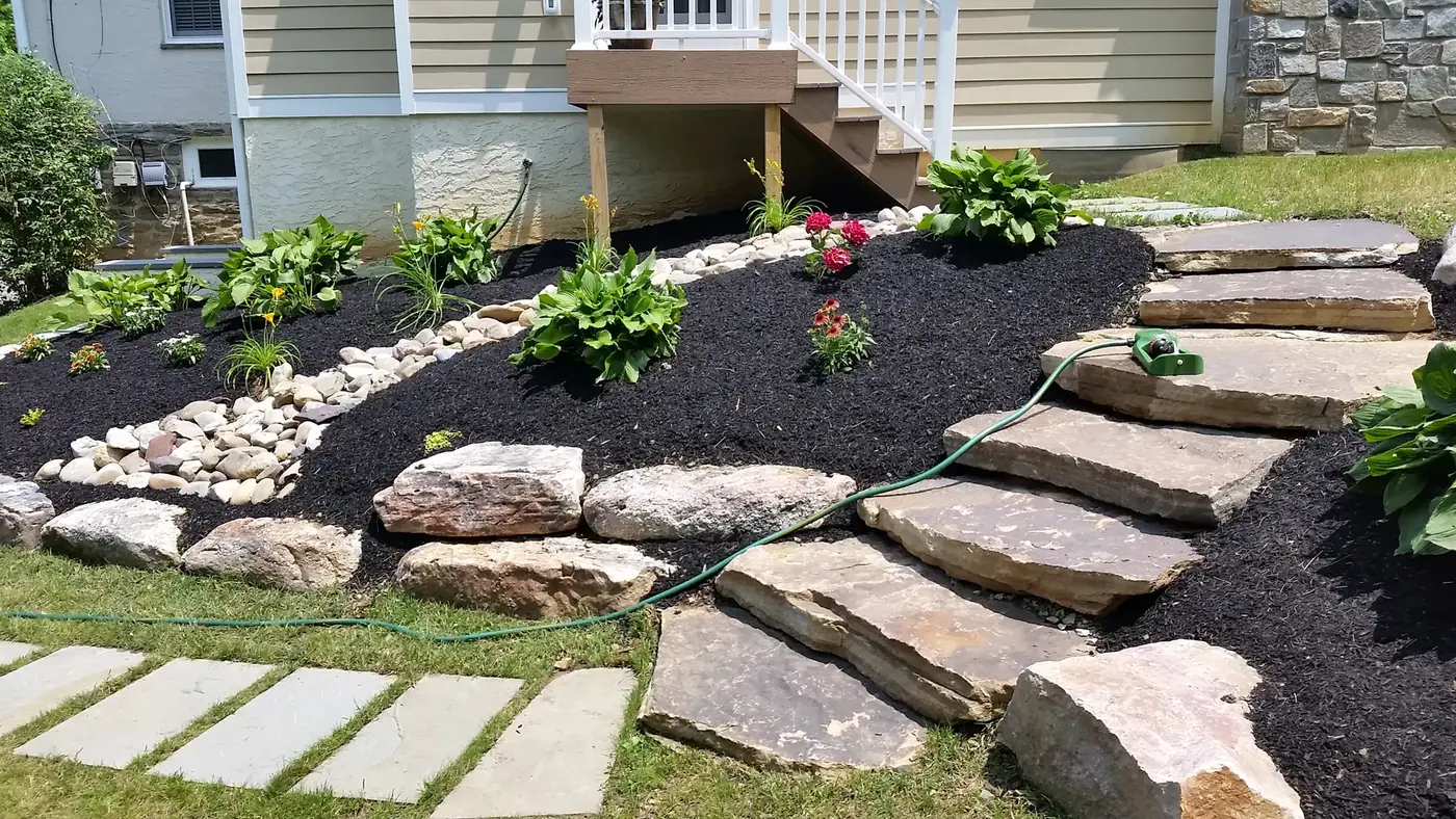 A finished local residential stone path and planted garden